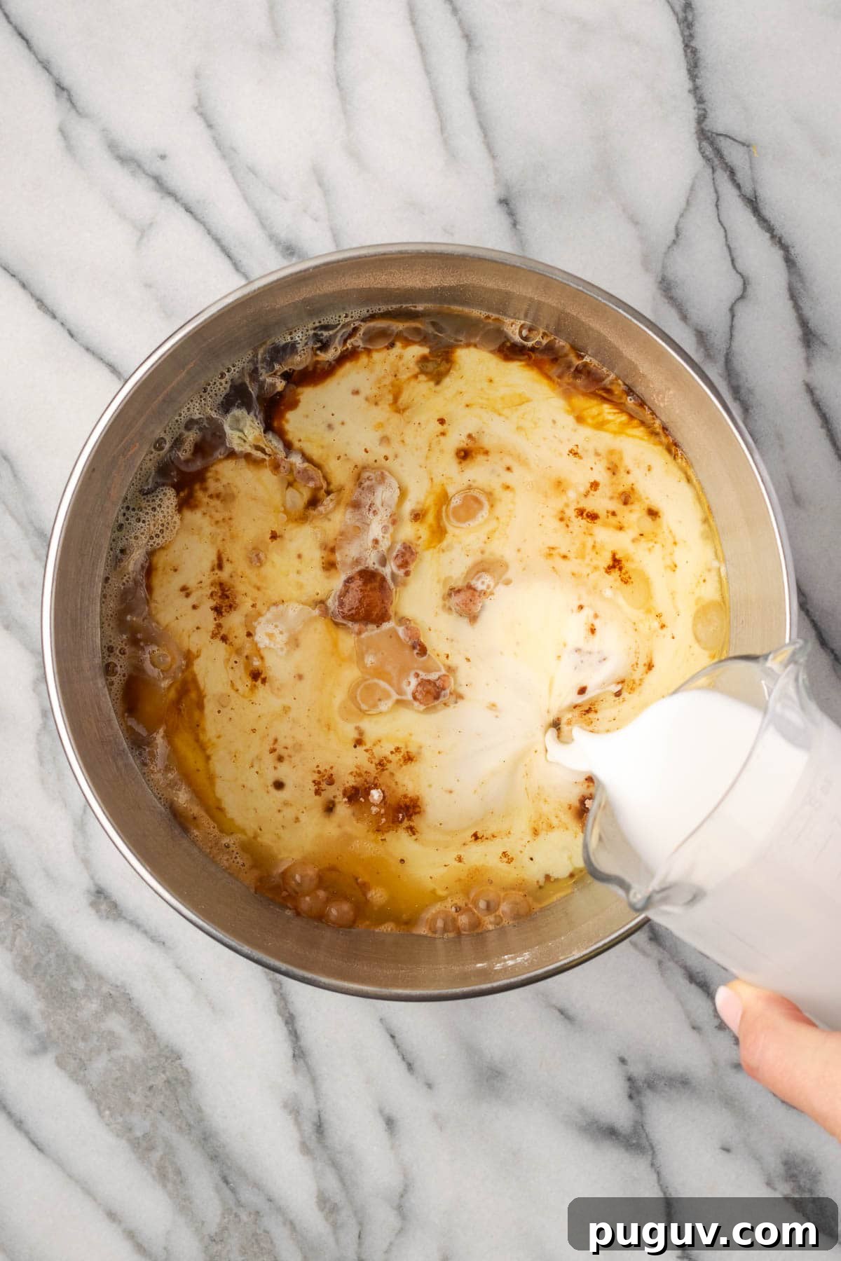 Decadent Chocolate Coconut Cake Recipe (Moist & Easy to Make) 5 Eggs, oil, coconut milk, vanilla and coconut extract added to the bowl with the dry ingredients.