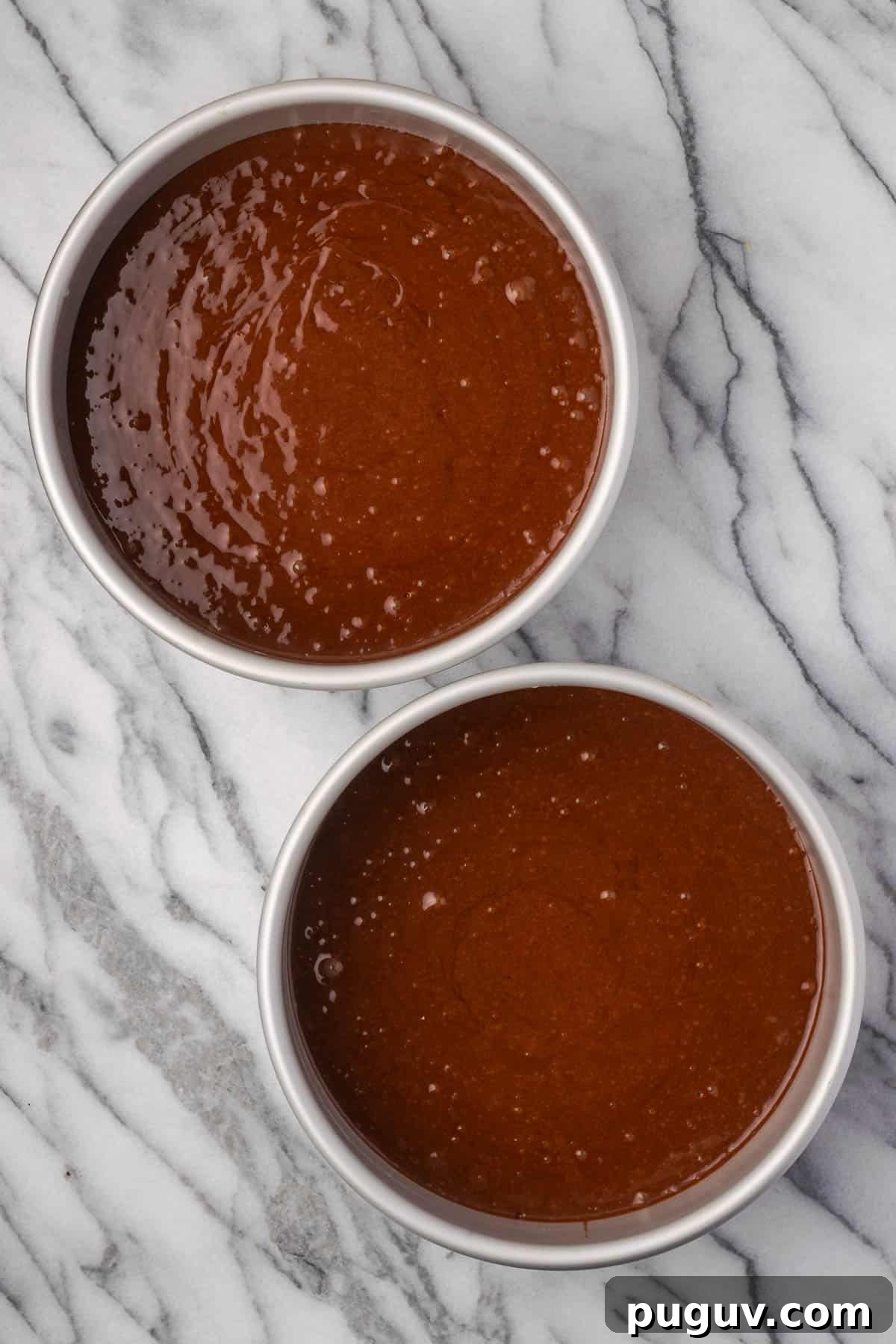 Decadent Chocolate Coconut Cake Recipe (Moist & Easy to Make) 7 Chocolate cake batter divided between two round cake pans.