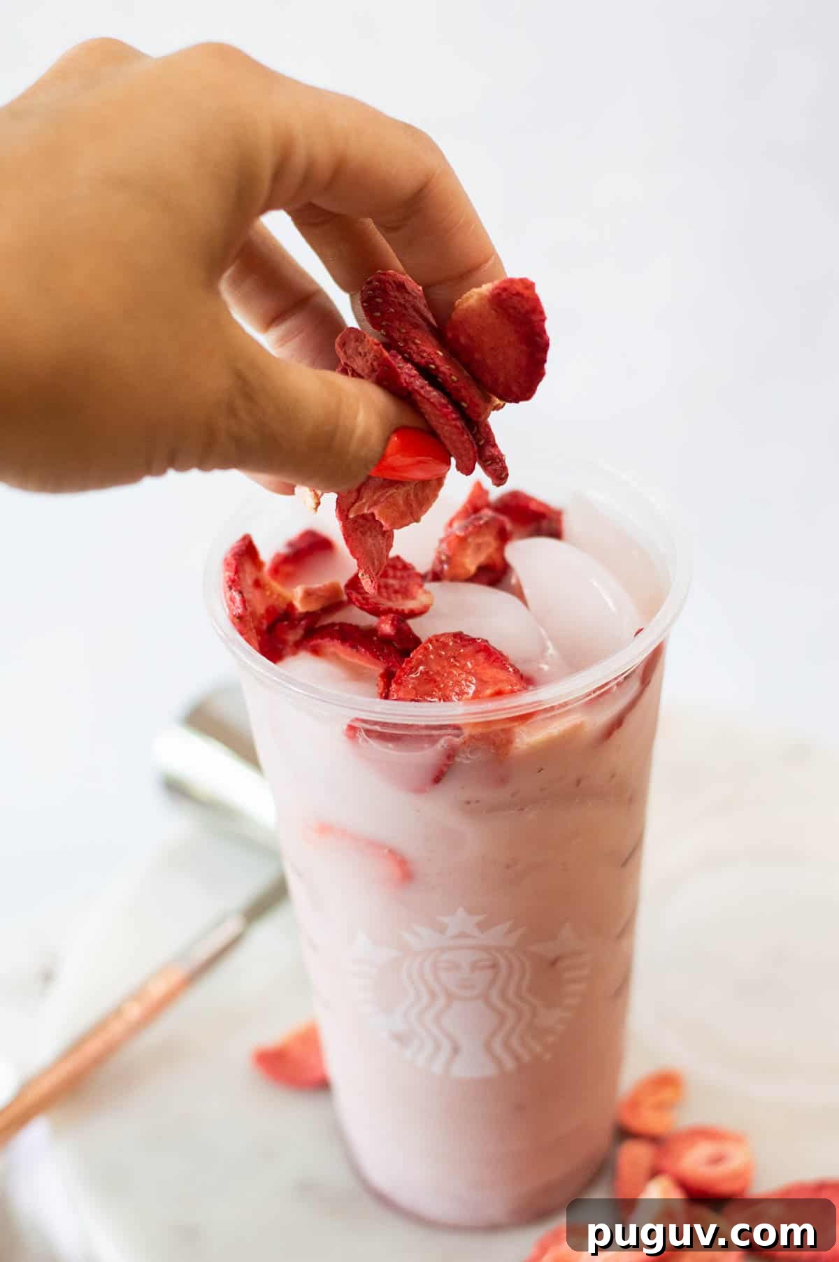 Starbucks Pink Drink Copycat Recipe: How to Make It at Home 7 Starbucks Pink Drink Copycat in a plastic cup