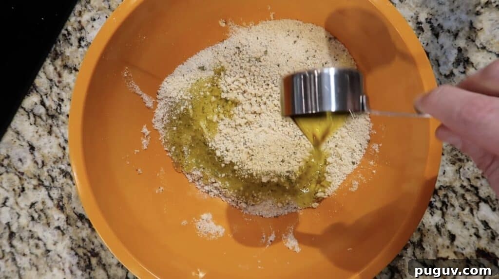 Remaining breadcrumbs having oil added to themn
