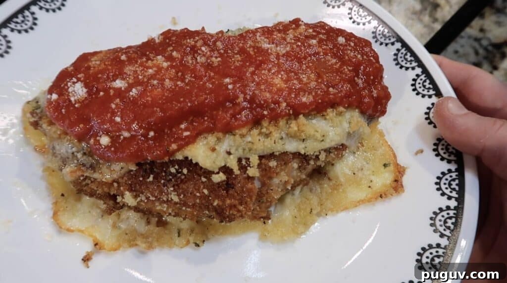 A plate of the mozzarella stick chicken parmesan.