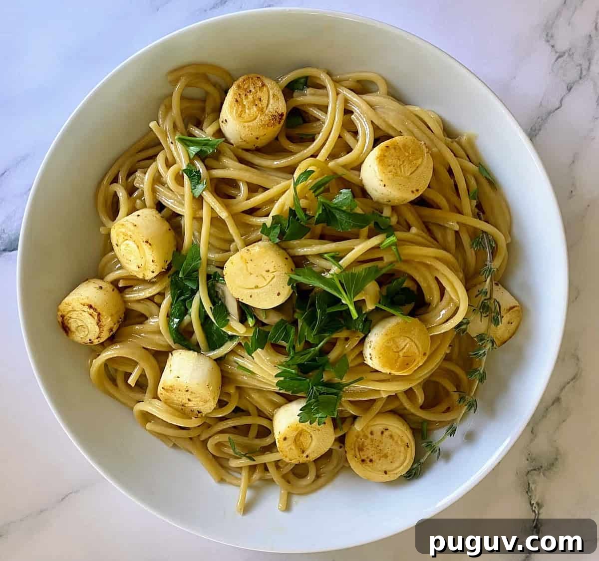 Crispy Vegan Scallops Recipe with Garlic Lemon Butter Sauce 8 vegan scallops recipe served with creamy garlic pasta in a bowl on the table