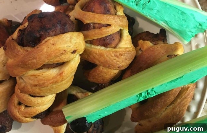 Check out these Ridiculously Simple Mini Mummy Legs! They're served with super creepy zombie fingers for the perfect Halloween dinner!