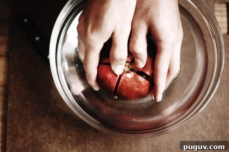 Separating cut pomegranate sections in water 