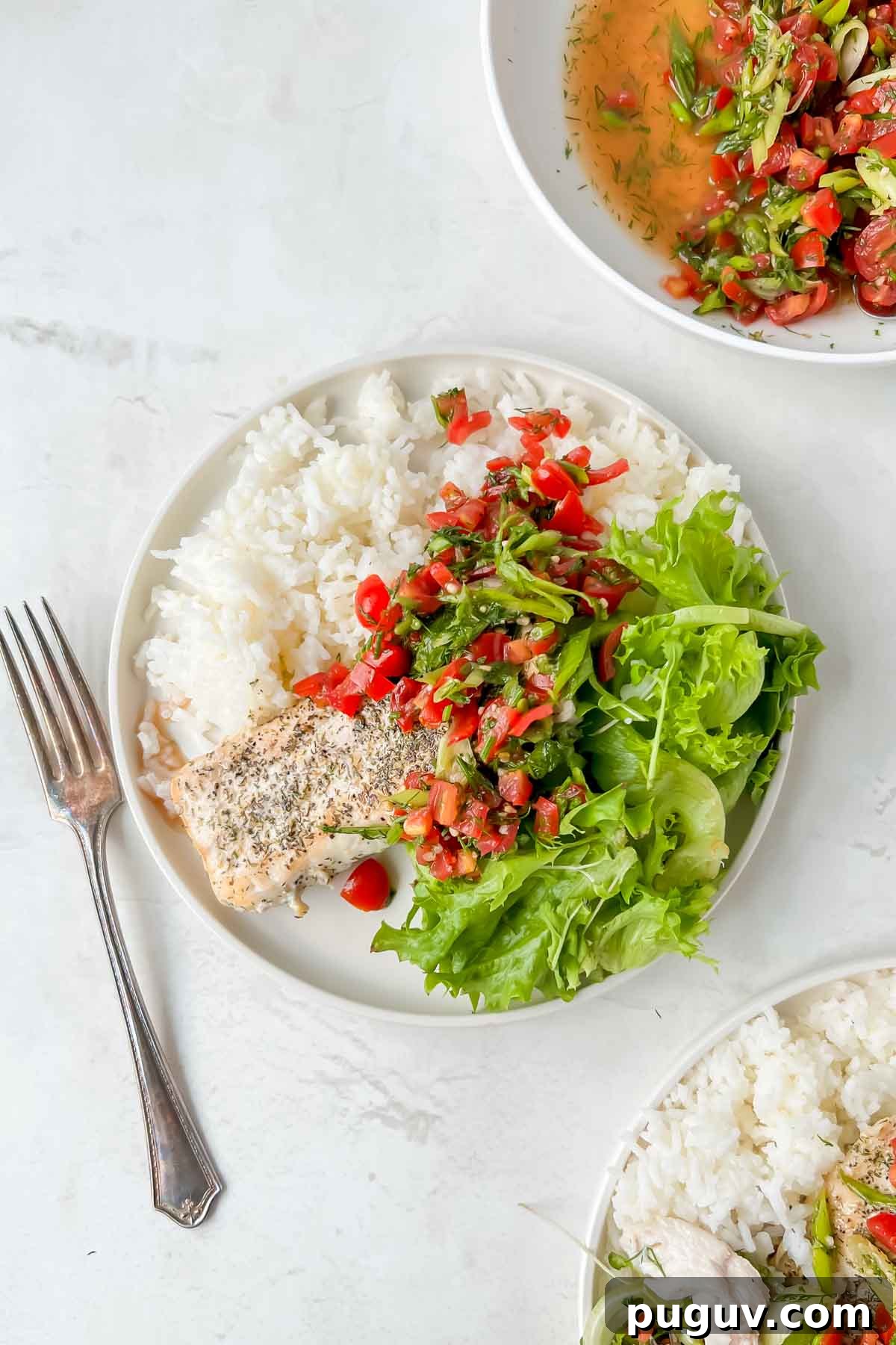 Tangy Tomato Relish Recipe for Sandwiches, Burgers & Tapas 2 serving plate filled with rice, mahi mahi and greens with tomato relish on top.