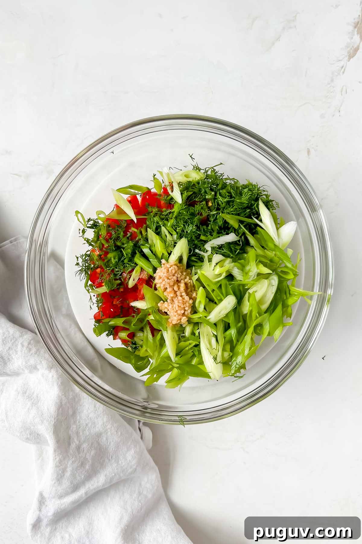 Tangy Tomato Relish Recipe for Sandwiches, Burgers & Tapas 5 tomato relish ingredients in clear glass mixing bowl before tossing.