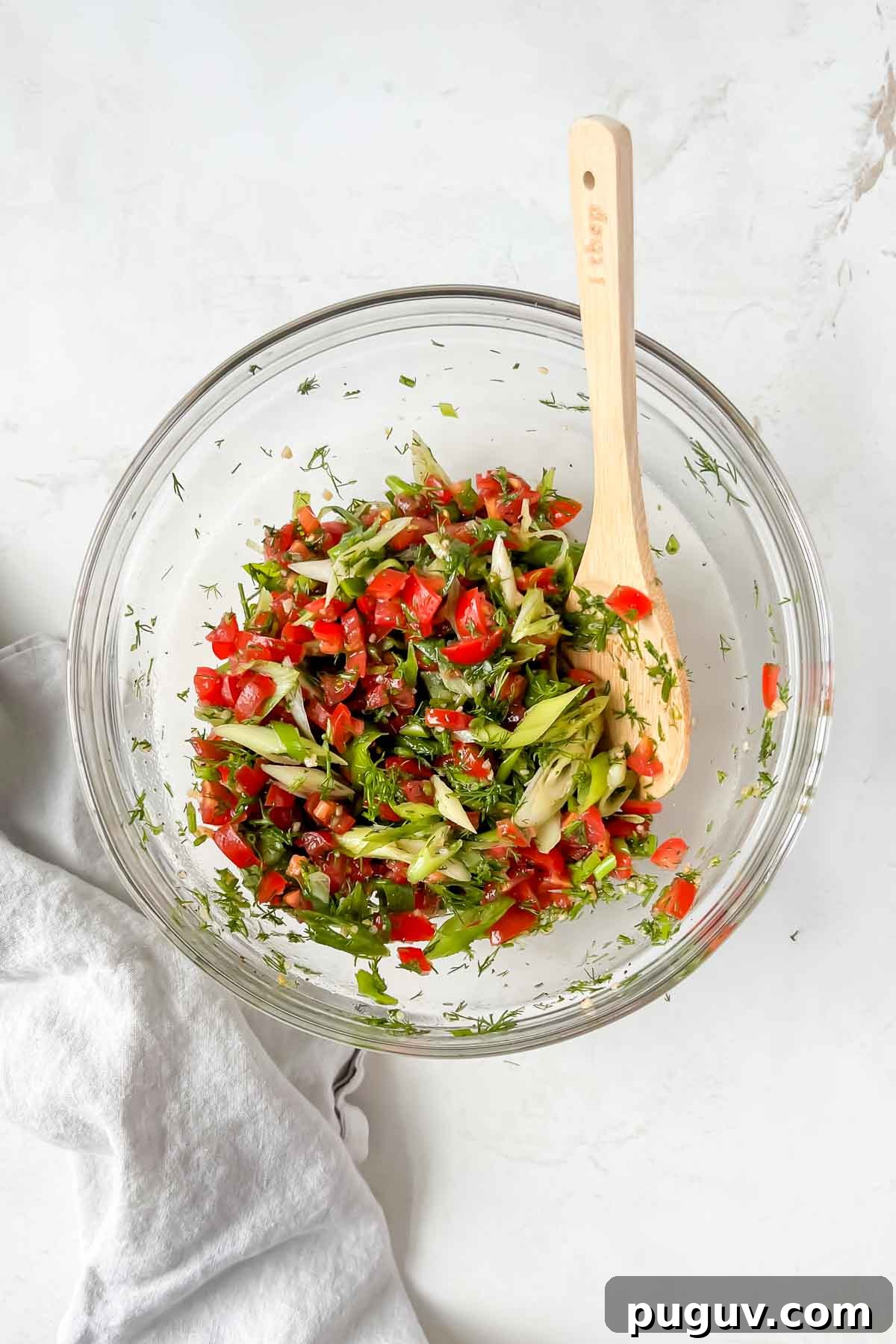 Tangy Tomato Relish Recipe for Sandwiches, Burgers & Tapas 6 tomato relish ingredients tossed in clear glass mixing bowl.