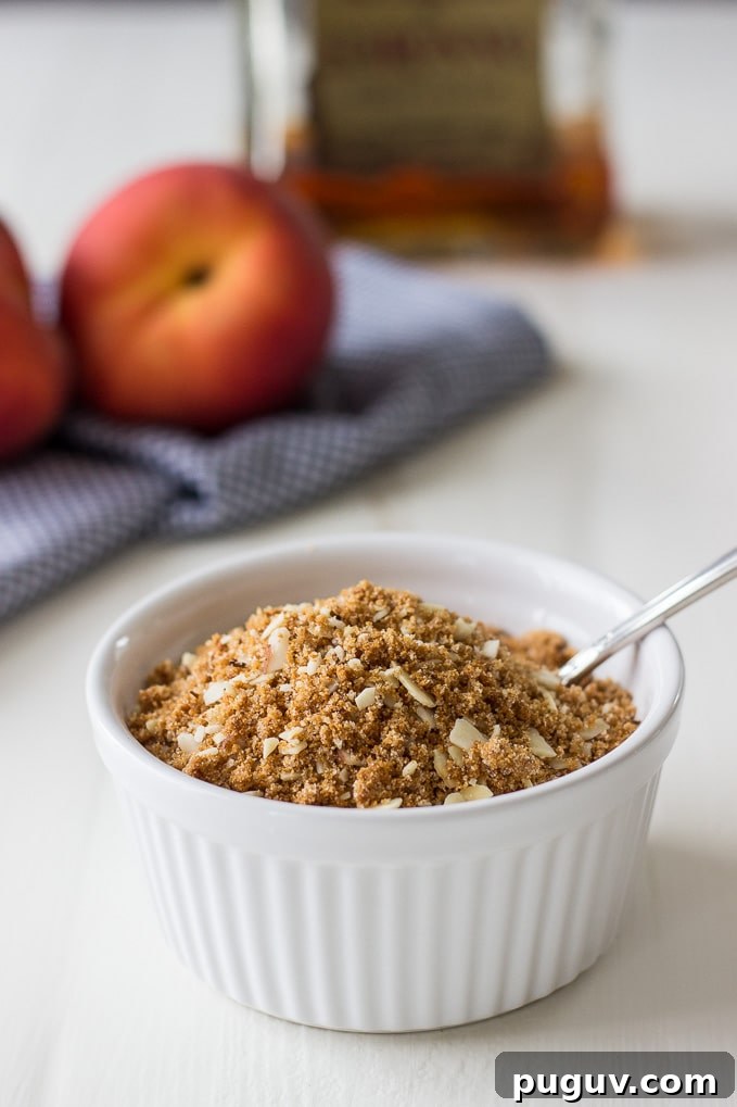 Amaretto-Stuffed Peaches with Almond & Biscoff Cookie Crumble 4 Almond-Biscoff-Cookie-Stuffed-Peaches-Amaretto.jpg