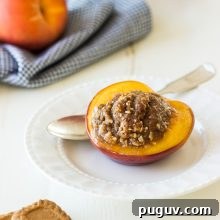 Amaretto-Stuffed Peaches with Almond & Biscoff Cookie Crumble 6 Almondand Biscoff Cookie Stuffed Peaches with Amaretto
