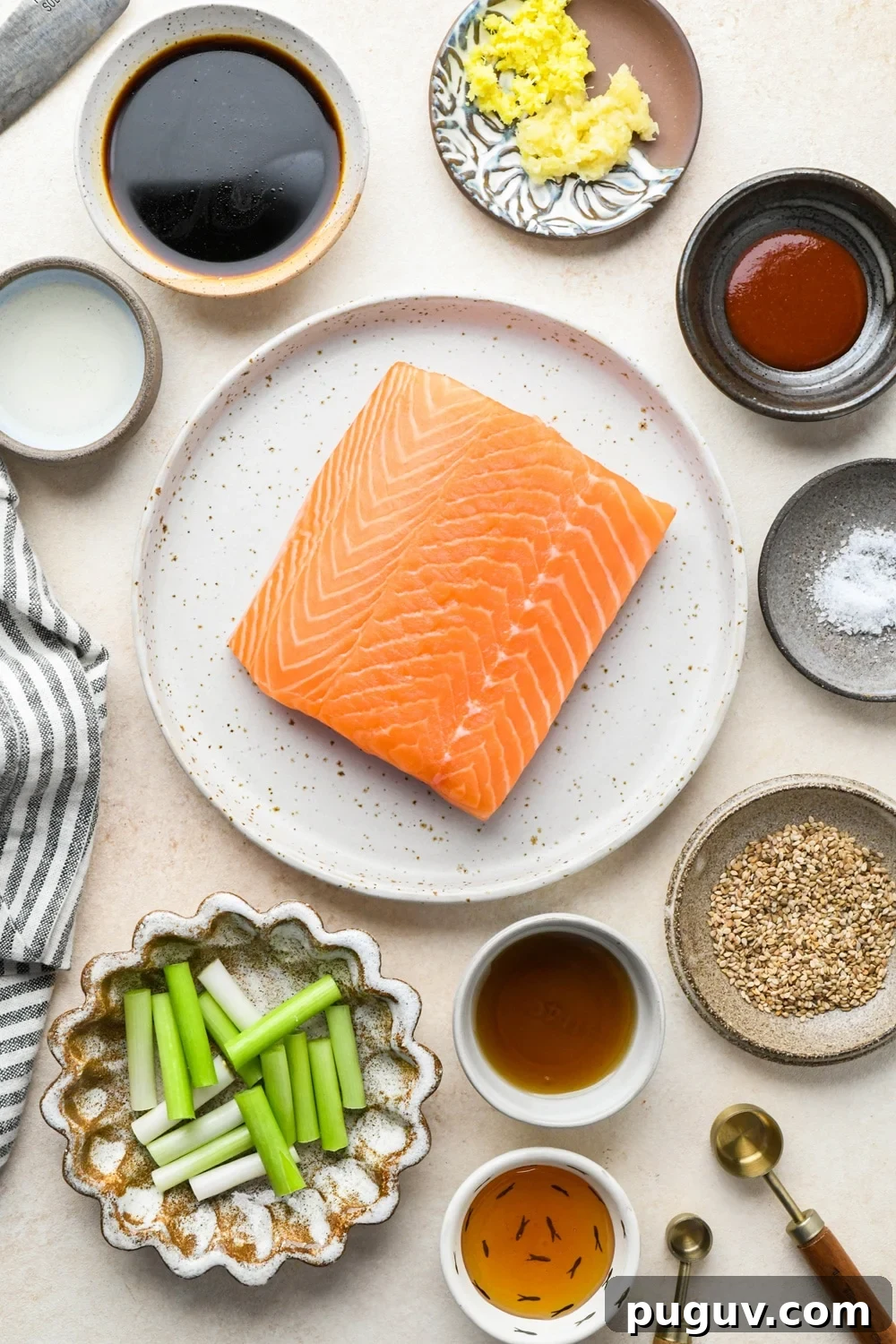 30-Minute Garlic-Ginger Glazed Salmon Recipe (Gluten-Free) 5 Ingredients for 30-minute garlic ginger salmon in various ceramics on a cream colored background.