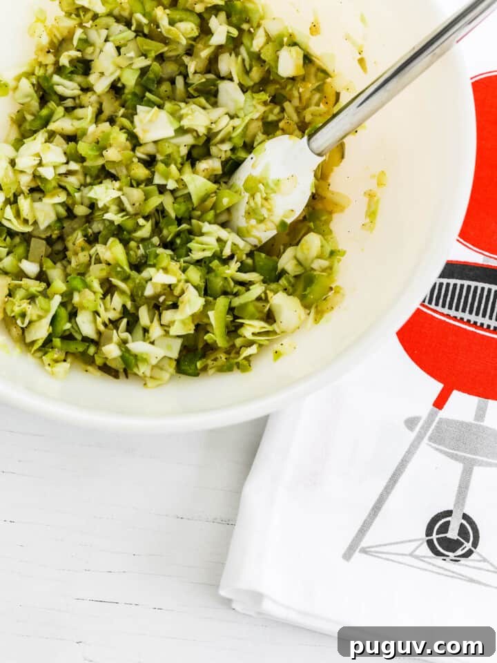 Relish recipe mixed in white bowl with cute bbq towel.