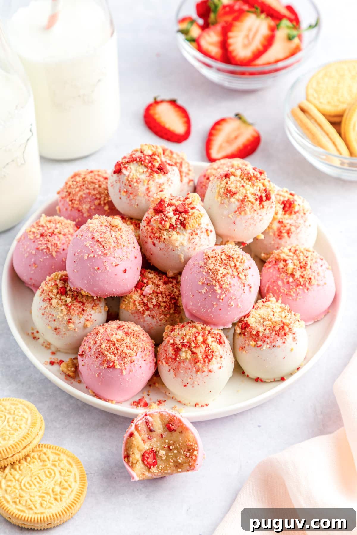 Strawberry Crunch Cookie Balls Recipe — No-Bake Dessert Bites 2 strawberry crunch cookie balls on a serving plate