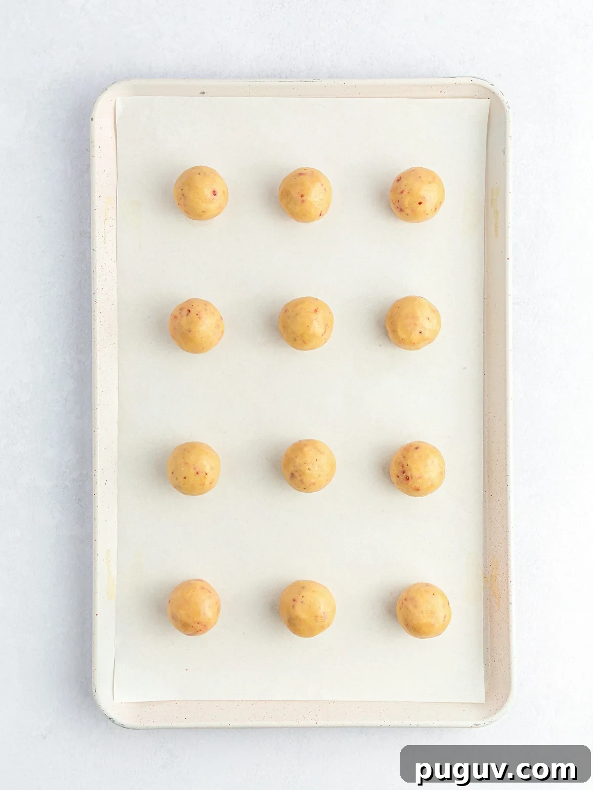 Strawberry Crunch Cookie Balls Recipe — No-Bake Dessert Bites 7 rolled cookie balls on lined cookie sheet
