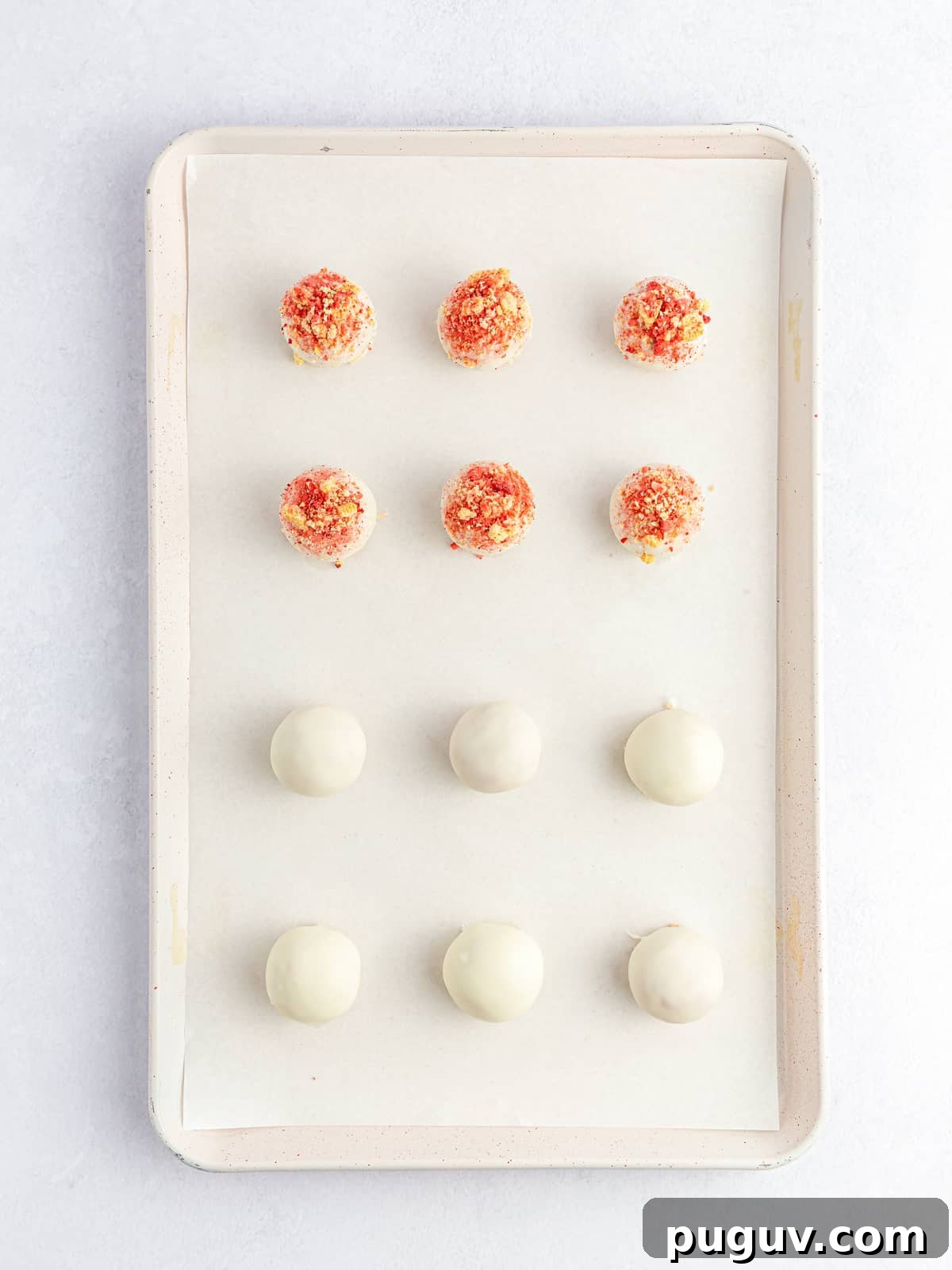 Strawberry Crunch Cookie Balls Recipe — No-Bake Dessert Bites 10 top dipped cookie balls with strawberry crunch topping before drying on cookie sheet