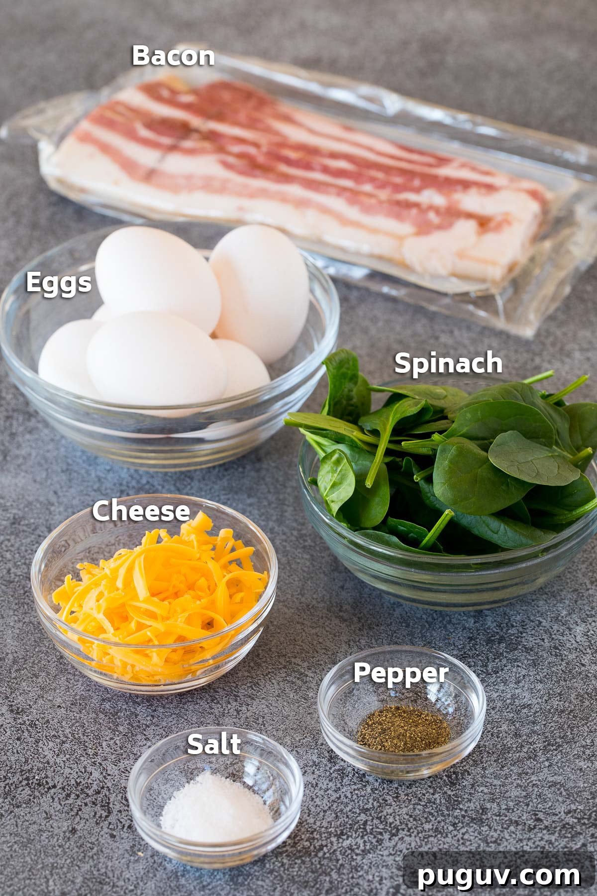 Ingredients including eggs, spinach, cheese and seasonings.