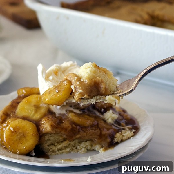Decadent Bananas Foster Butter Cake Recipe for Dessert Fans 7 Taking a bite of Bananas Foster Butter Cake. {St. Louis Gooey Butter Cake with Bananas Foster Sauce}