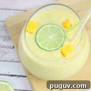 30 Nourishing Dairy- and Gluten-Free Snacks for Breastfeeding 7 Mango protein smoothie in a glass