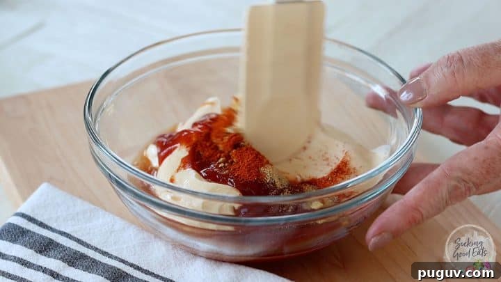 Creamy Yum Yum Sauce Recipe: Simple Homemade Japanese Steakhouse Sauce 5 Stirring the yum yum sauce in a clear glass bowl