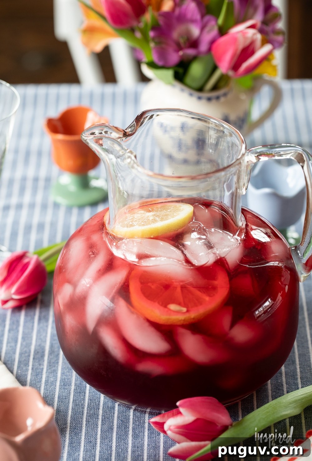 Pink Tulip Cocktail Recipe: Floral Vodka Drink Guide 4 pink tulip cocktail served in a glass pitcher.