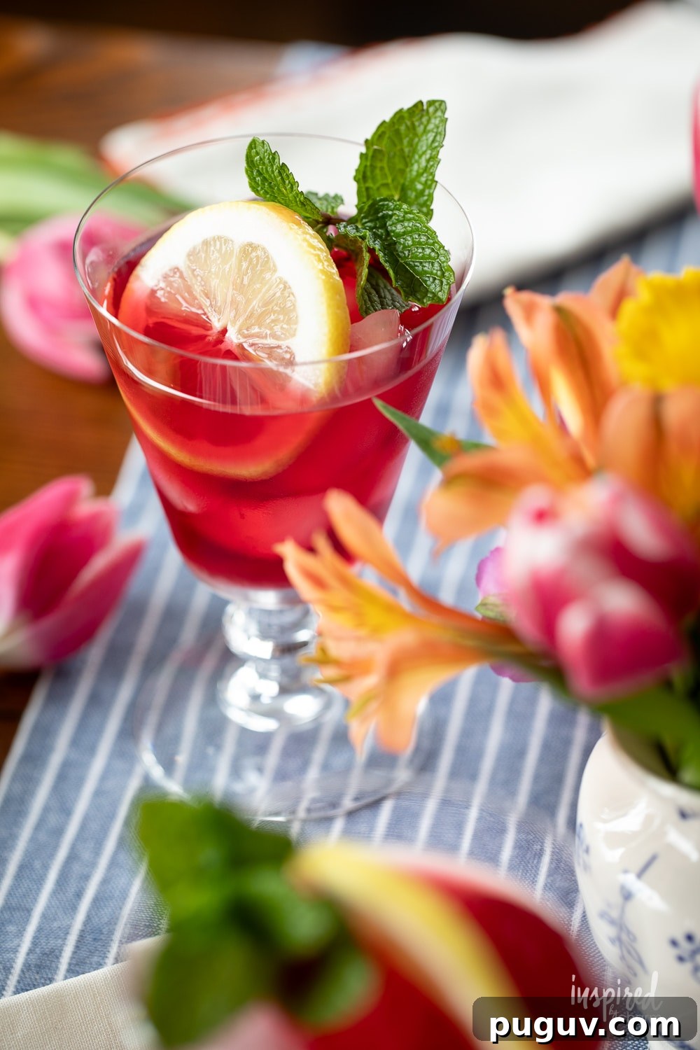 Pink Tulip Cocktail Recipe: Floral Vodka Drink Guide 6 pink tulip cocktail made with vodka served with lemon and mint.