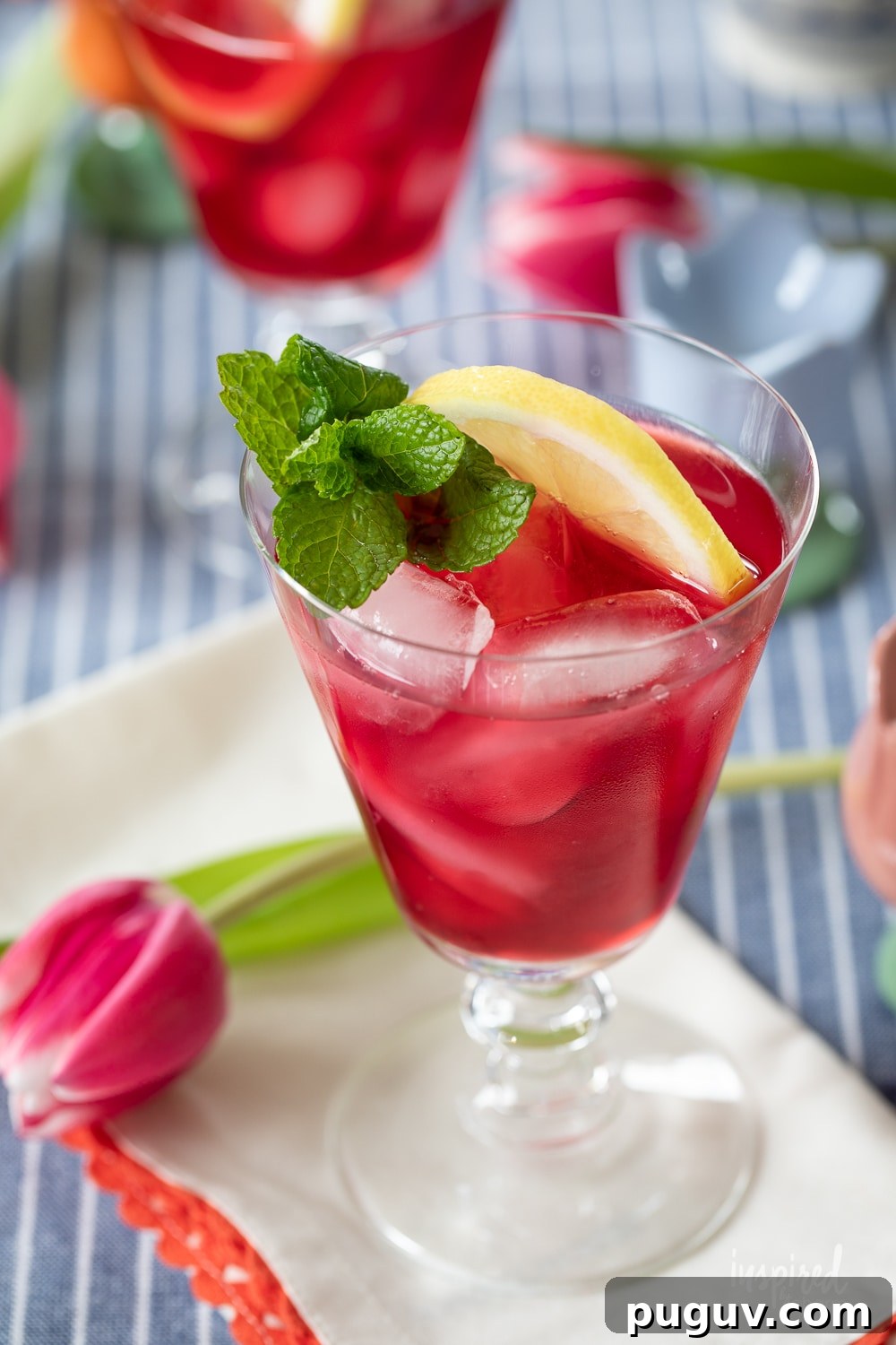 Pink Tulip Cocktail Recipe: Floral Vodka Drink Guide 10 pink tulip cocktail served in glasses with mint garnish and lemon garnish.