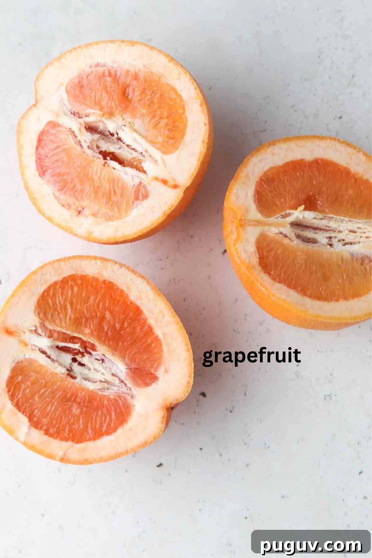 Grapefruits sliced in a half.