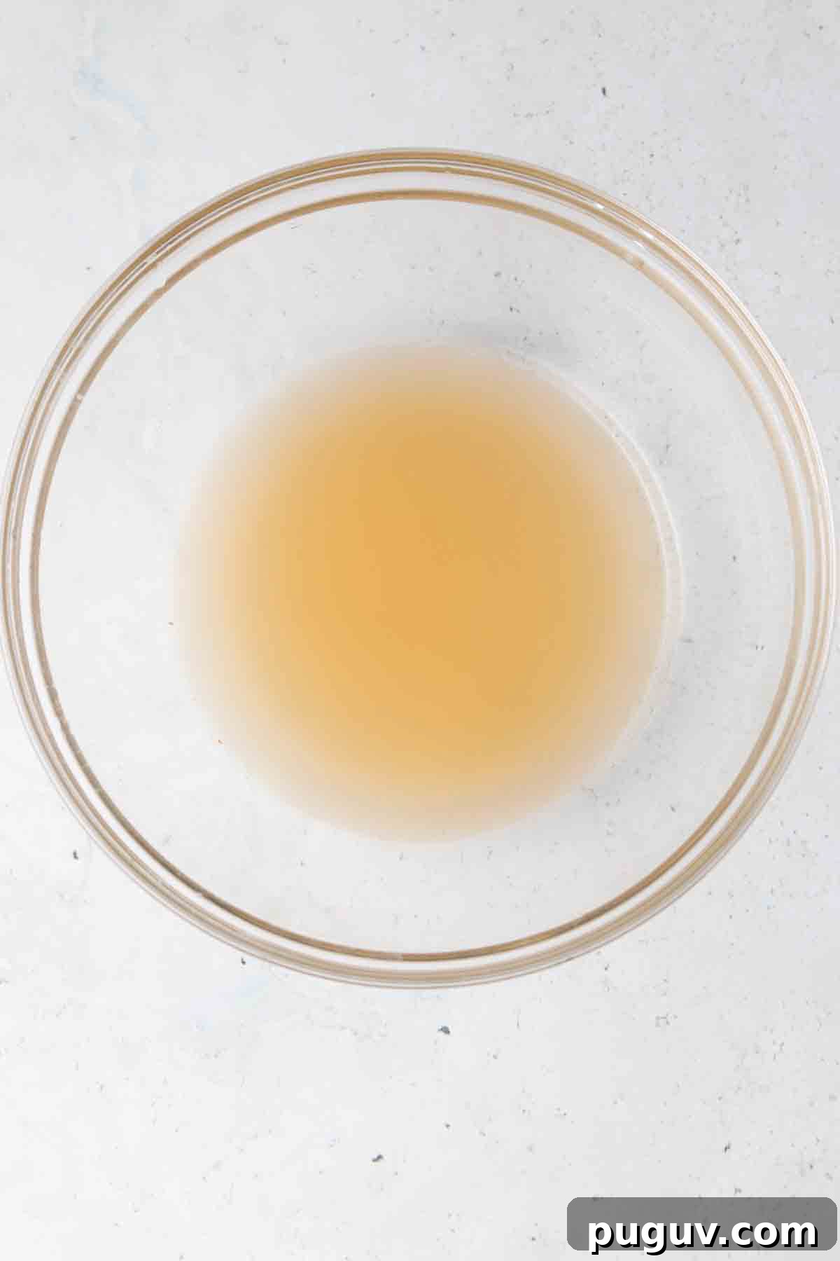 Grapefruit juice and club soda in a glass bowl.