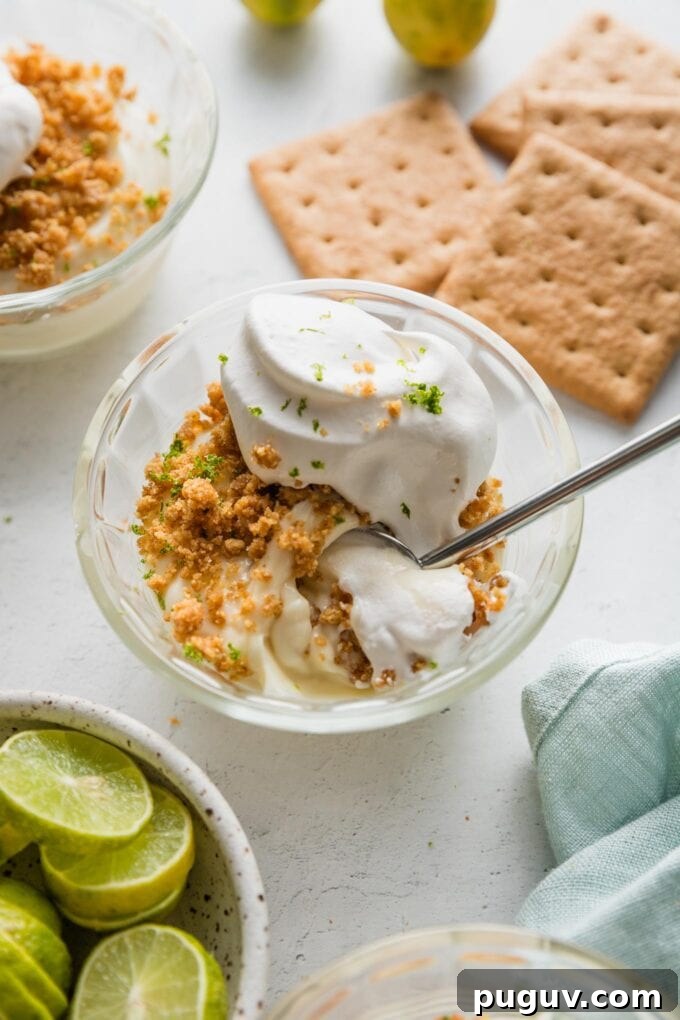 Close up of a spoonful of no bake key lime pie.