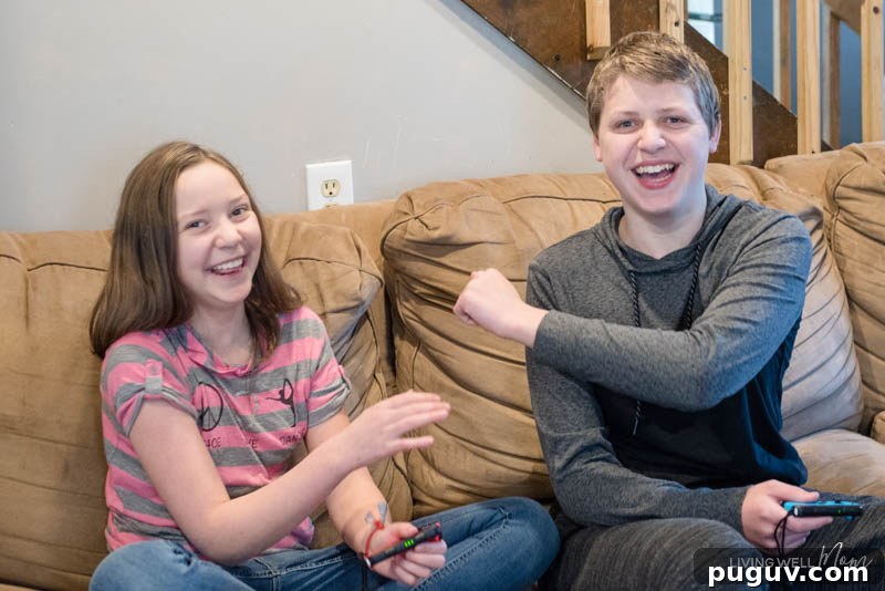 How a Gaming Console Can Bring Your Family Together 13 a boy and a girl sitting on a couch