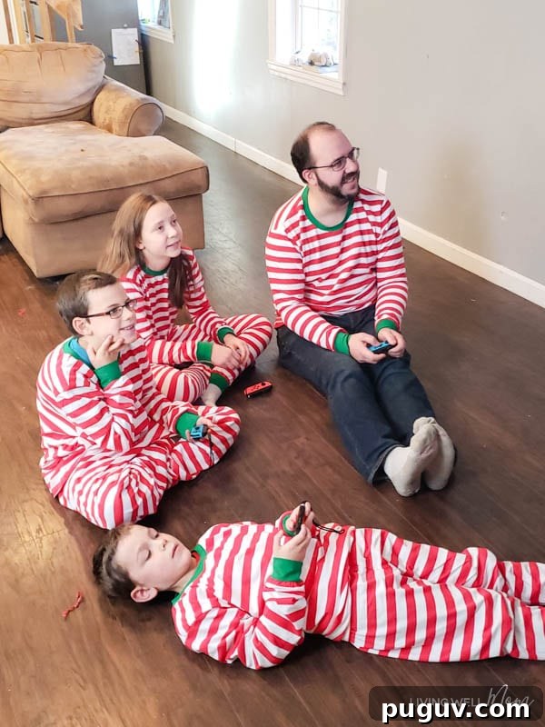 How a Gaming Console Can Bring Your Family Together 4 a Family playing a game in candy cane PJs