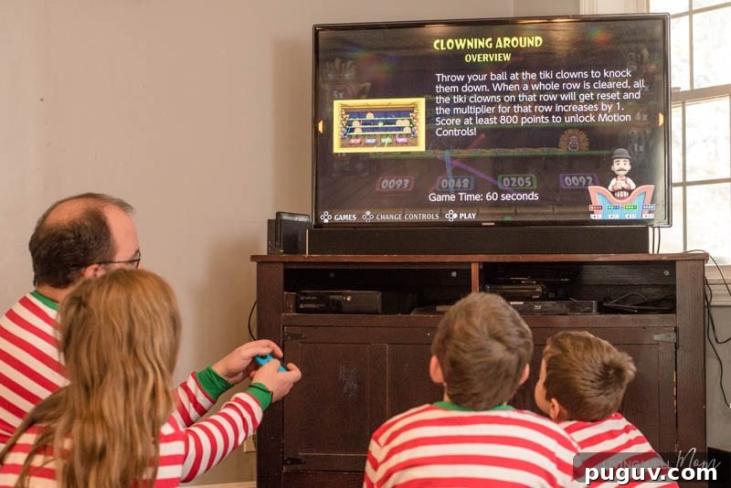How a Gaming Console Can Bring Your Family Together 6 A group of people standing in front of a television playing a Carnival game