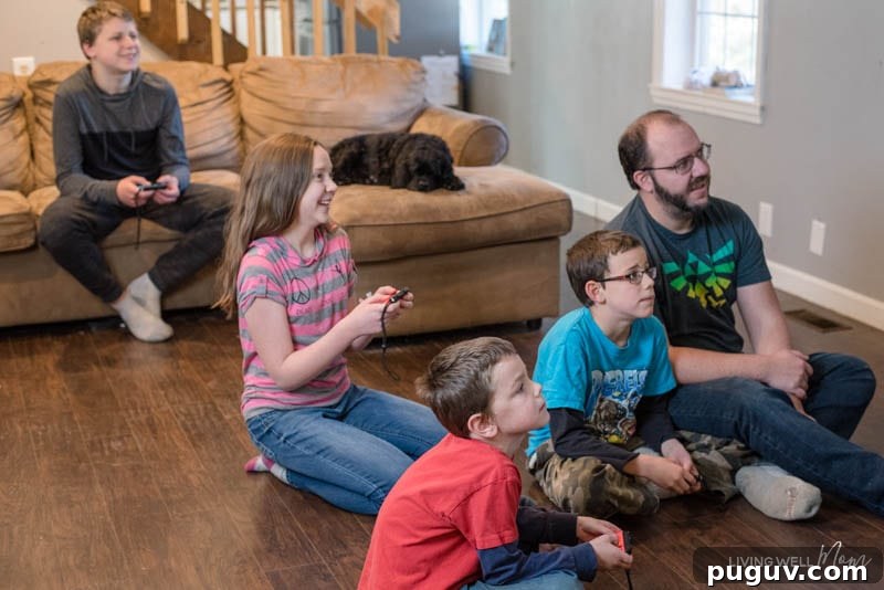 How a Gaming Console Can Bring Your Family Together 9 A group of people sitting around a living room playing a video game