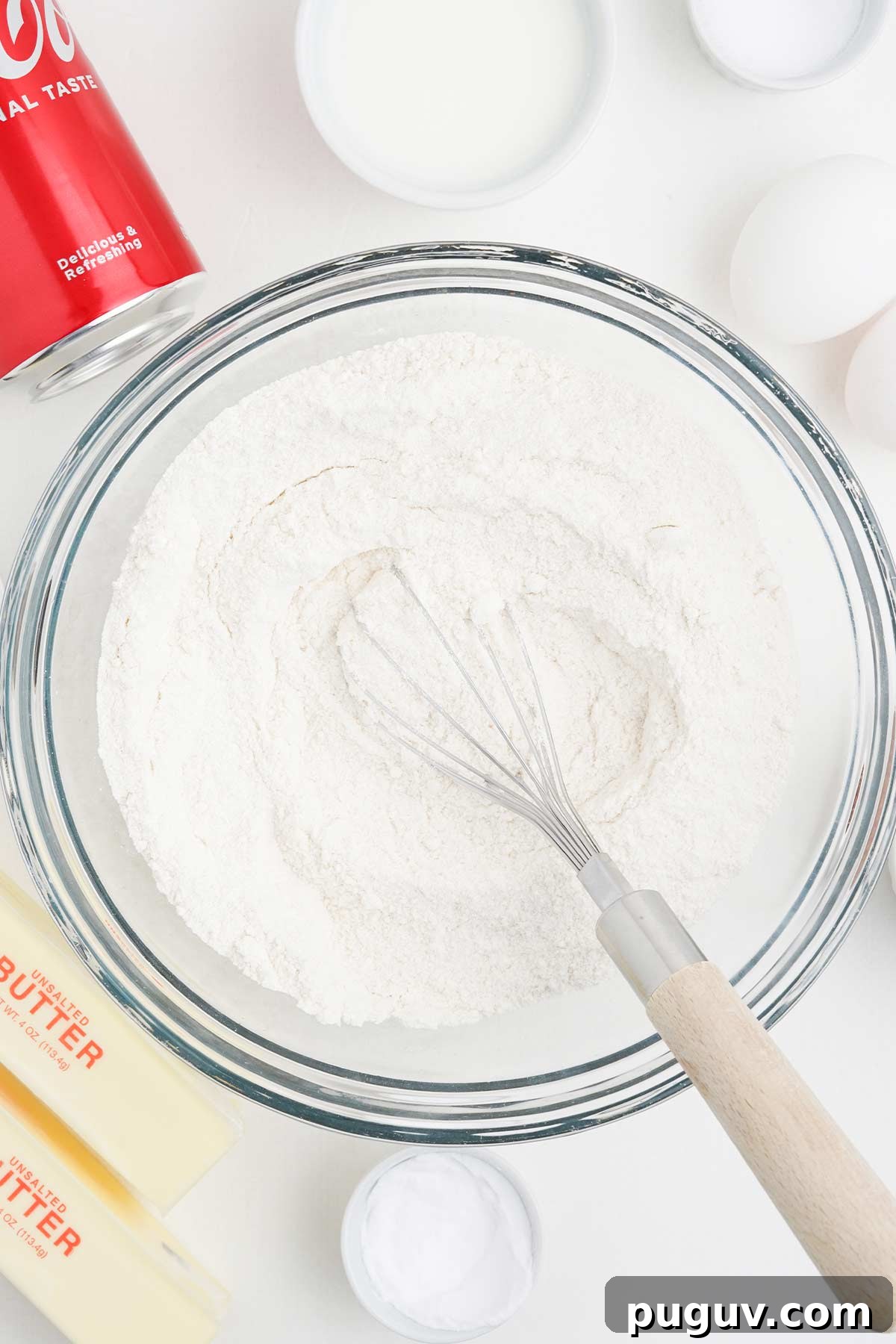Copycat Cracker Barrel Coca-Cola Cake Recipe You’ll Love 5 Mixing the dry ingredients to make coca cola cake.