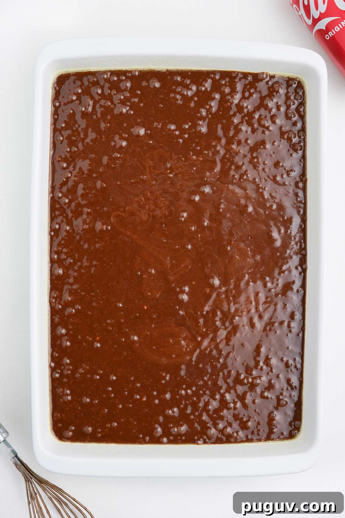 Copycat Cracker Barrel Coca-Cola Cake Recipe You’ll Love 8 Cake mix is poured into rectangular baking dish.