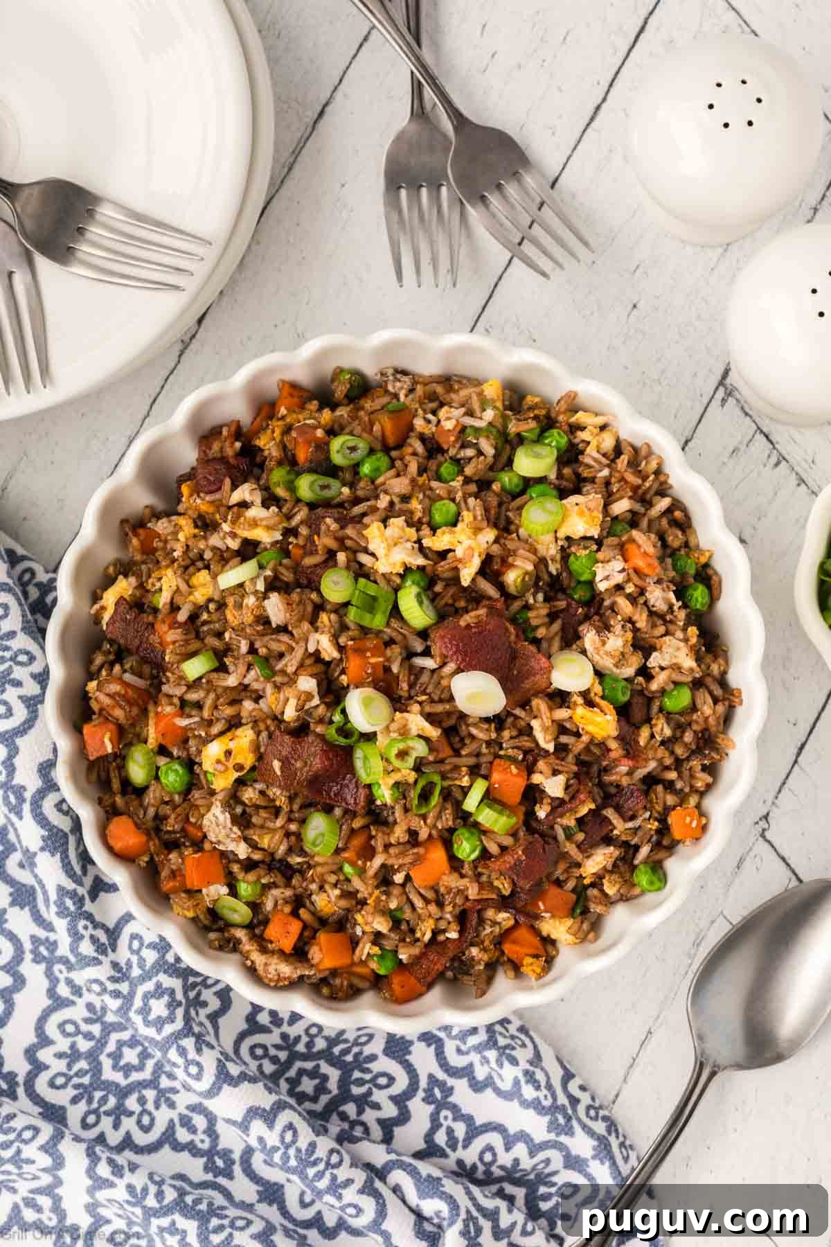 Breakfast Fried Rice in a bowl topped with chopped green onions