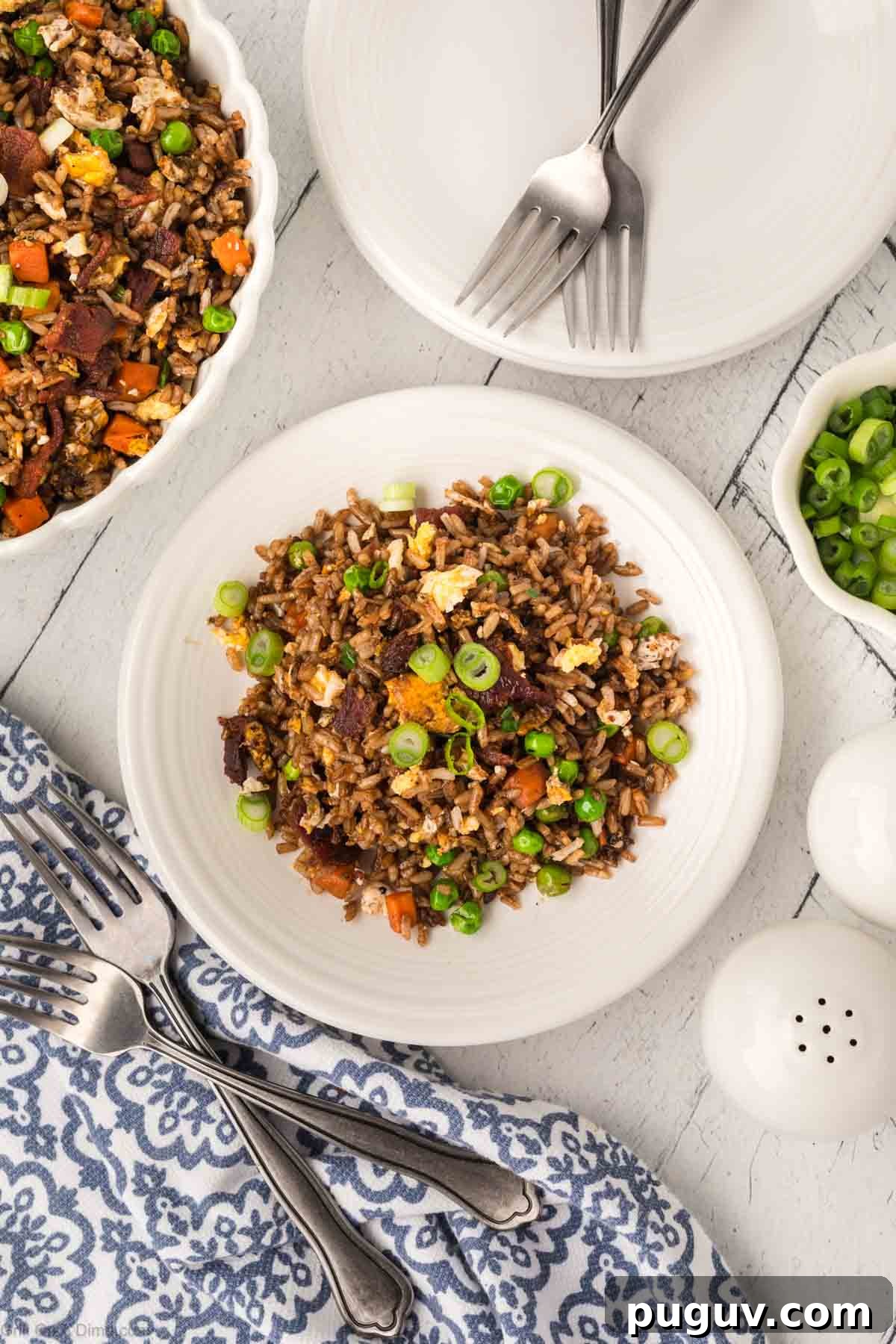 Breakfast Fried Rice on a plate topped with green onions