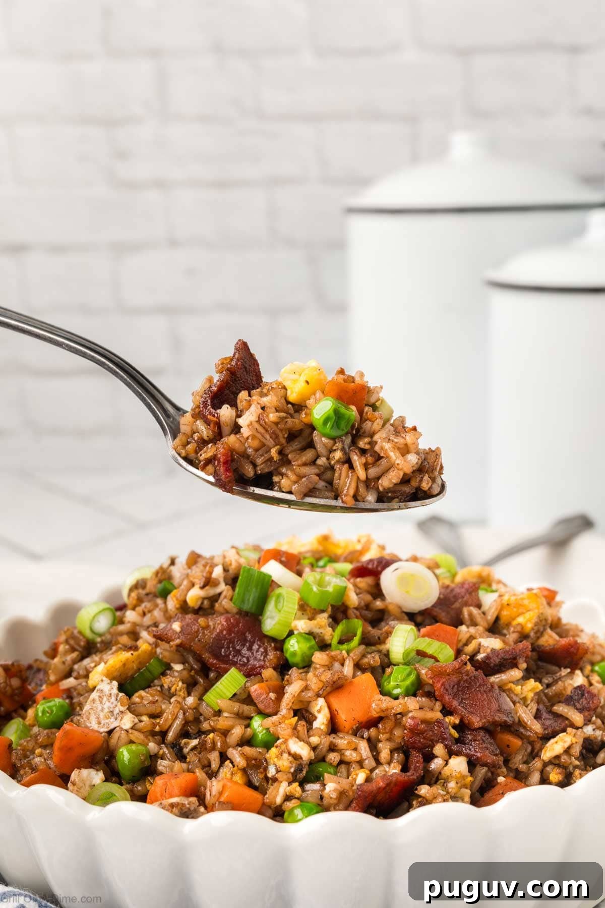 Breakfast Fried Rice in a bowl with a bite on a spoon
