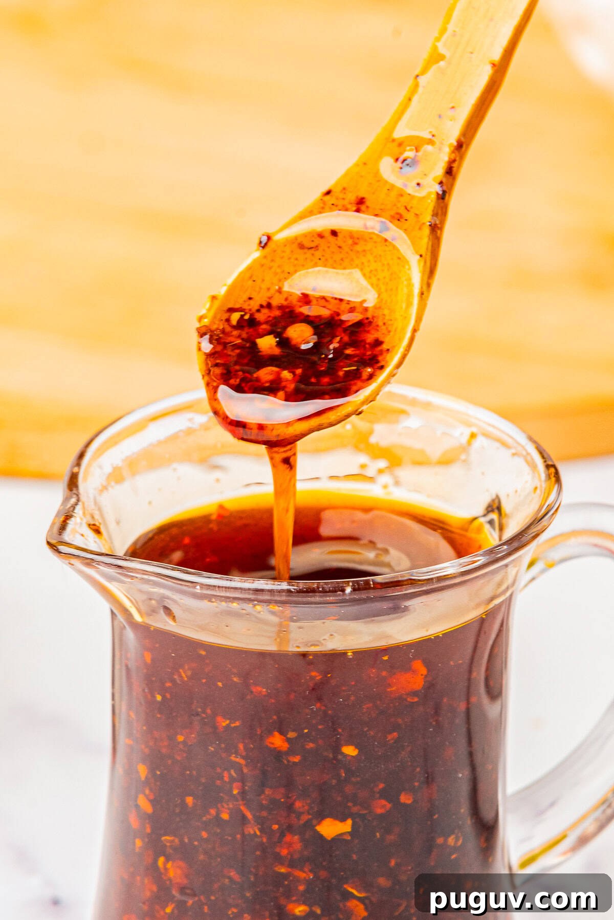 Homemade Chili Oil Recipe: Step-by-Step Guide for Authentic Flavor 8 close up image of Chili Oil on a spoon in air