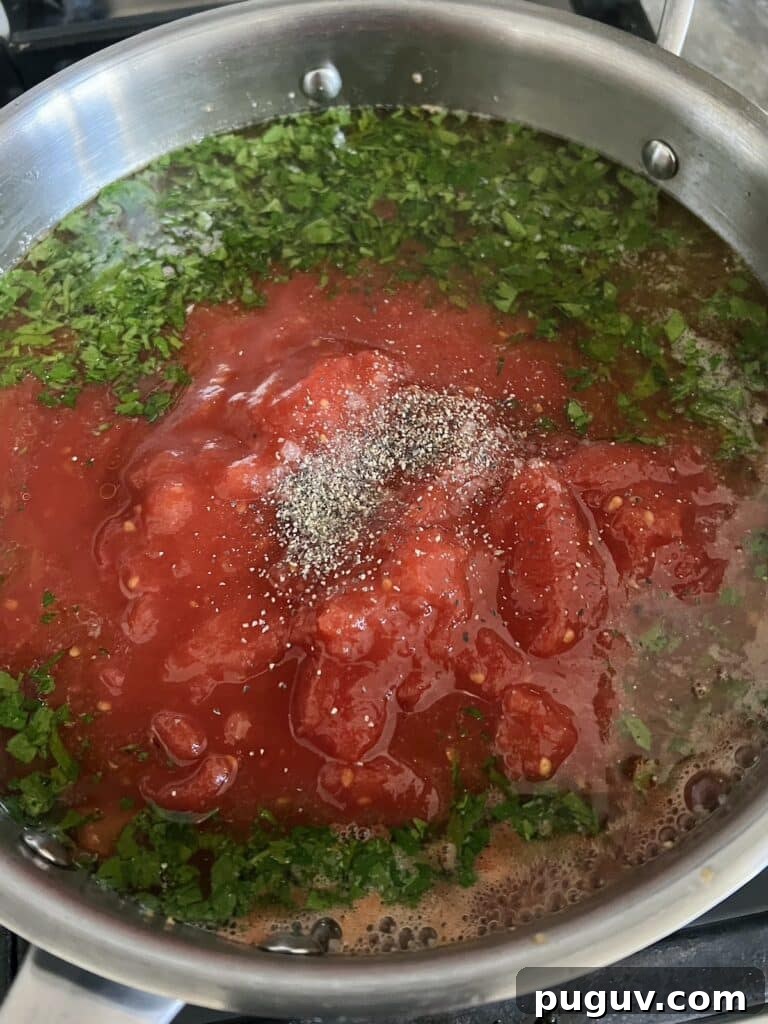 Clams Posillipo in Spicy Tomato Sauce (Zuppa di Vongole) 10 Tomato mixture simmering for zuppa di vongole.