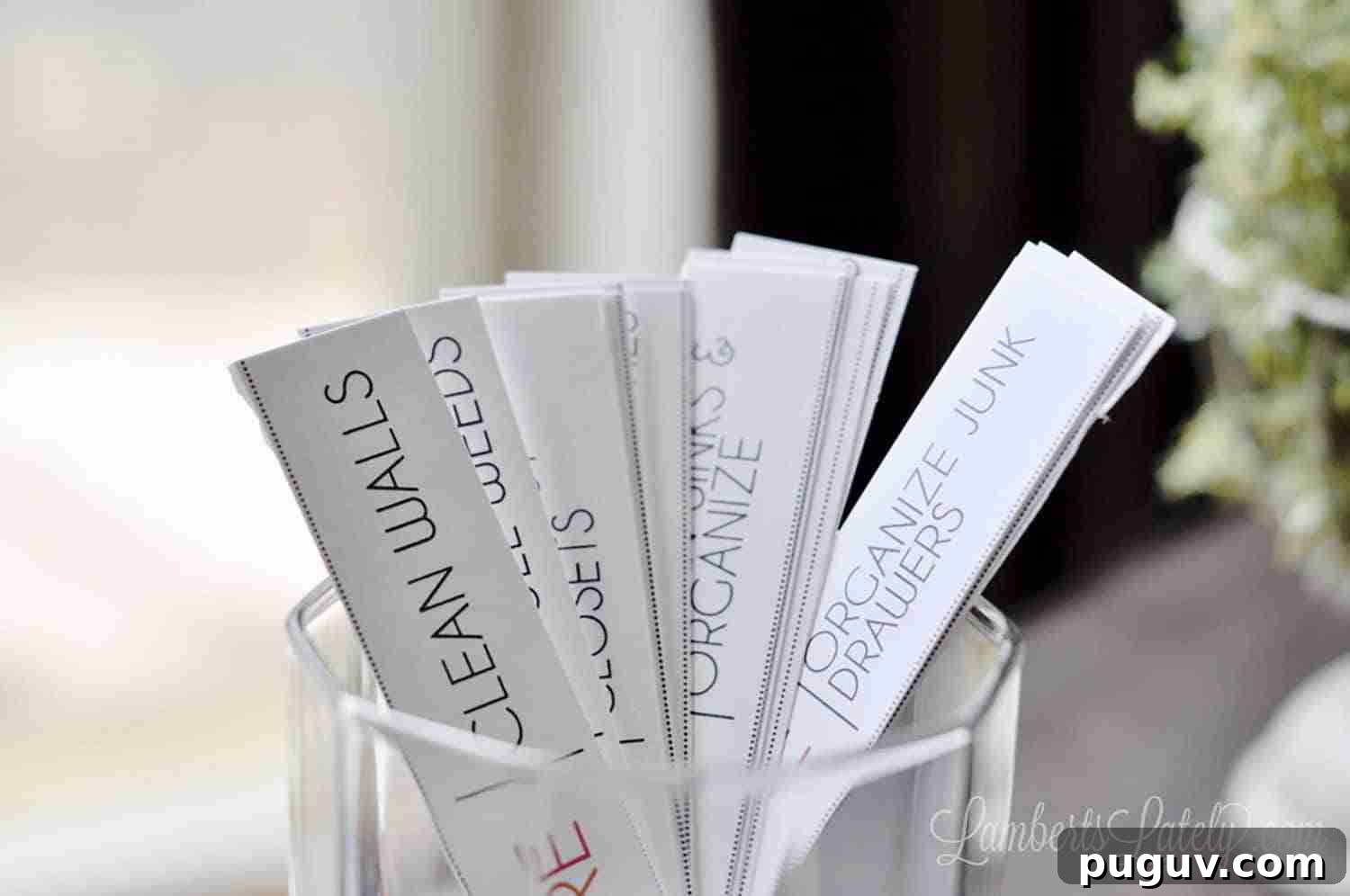 rectangular chore cards in a glass.