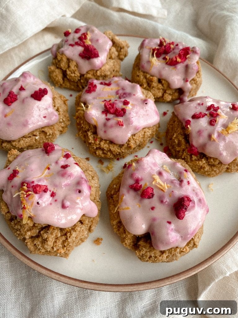cookies with raspberry yogurt frosting on plate