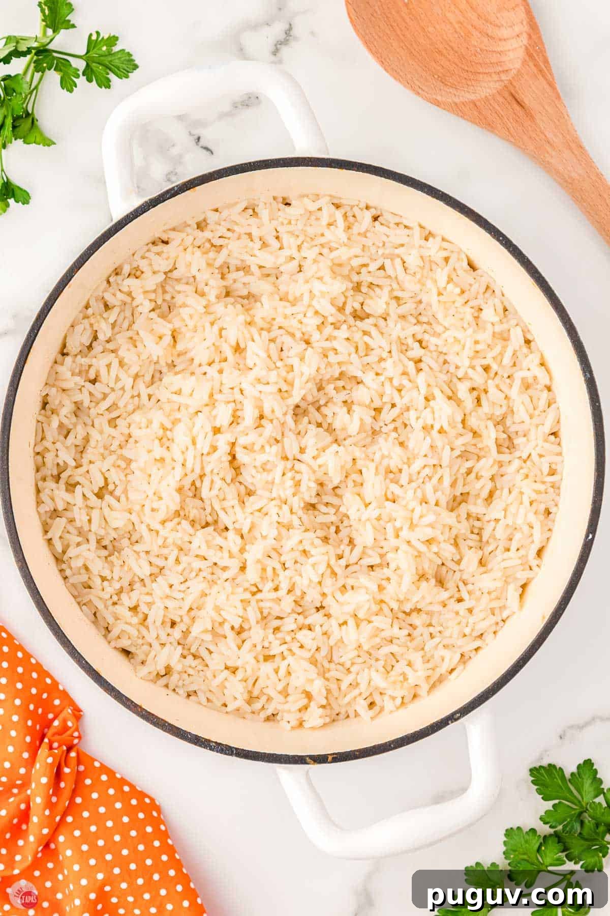 white pot filled with cooked white rice in it