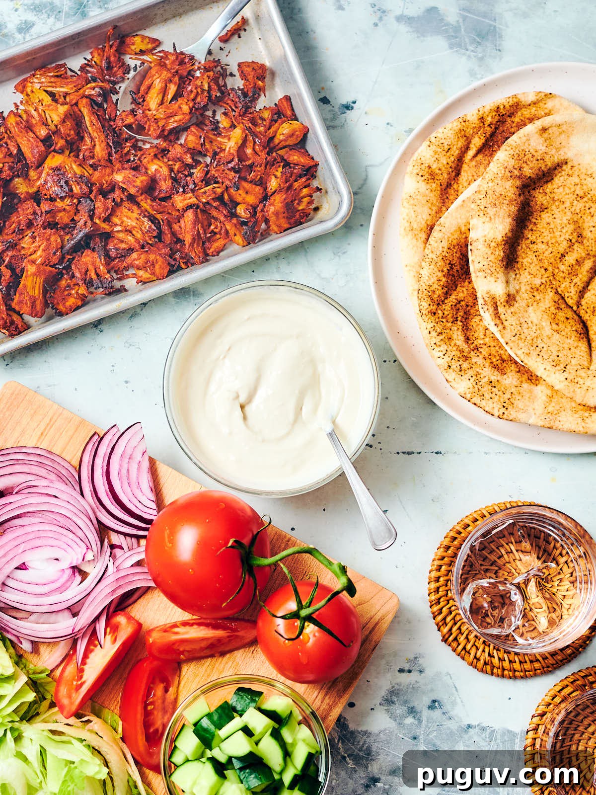 Yogurt tahini sauce with ingredients to make vegan shawarma.