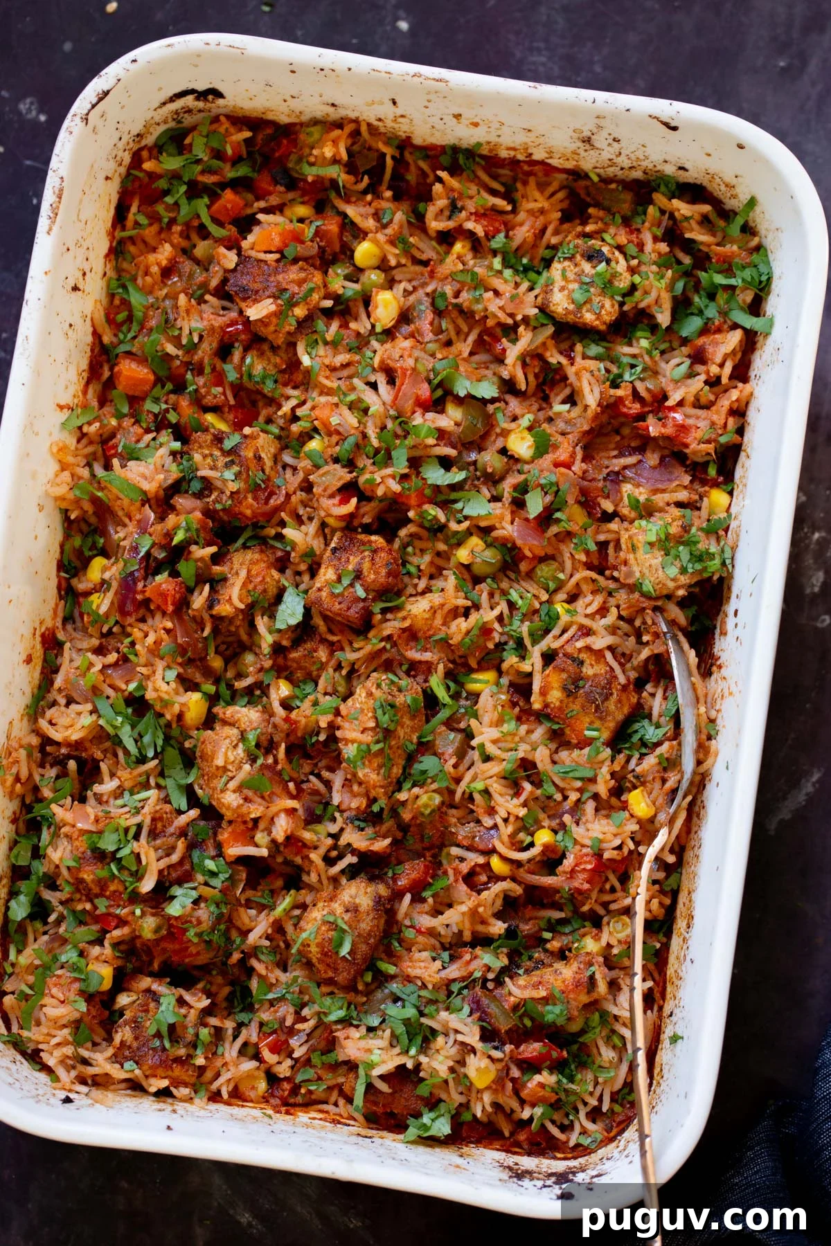 Crispy Tofu Tikka Masala Rice Bake Recipe 2 tikka masala rice in the baking pan after baking and fluffing