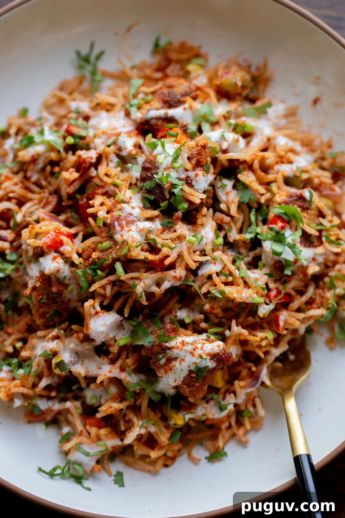 Crispy Tofu Tikka Masala Rice Bake Recipe 3 plate of tikka masala rice with a spoon in it