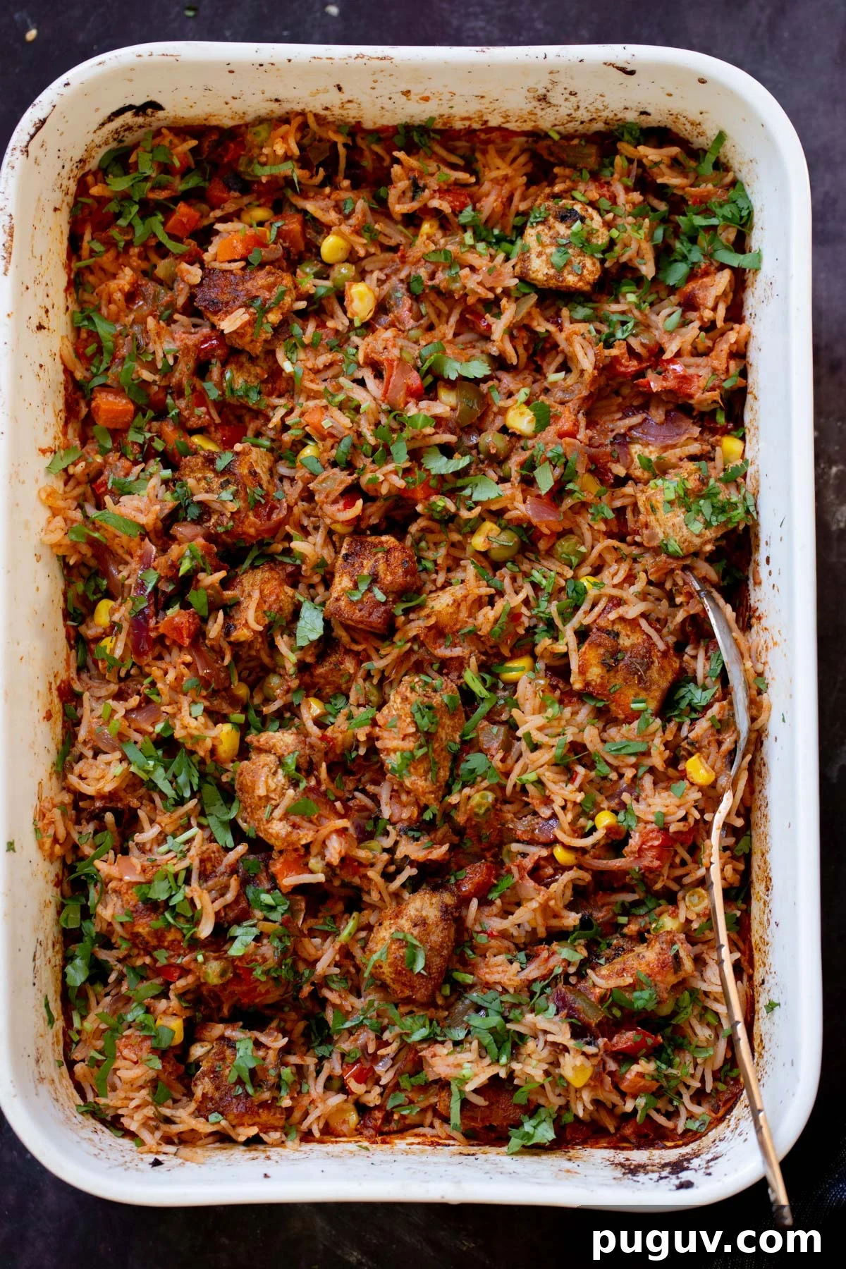 Crispy Tofu Tikka Masala Rice Bake Recipe 8 tikka masala rice in the baking pan after baking and fluffing