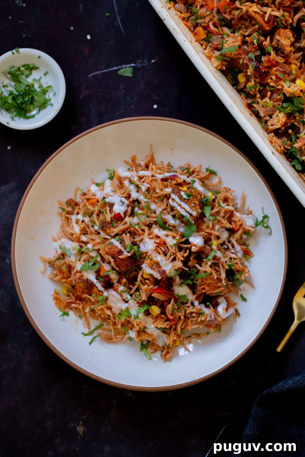 Crispy Tofu Tikka Masala Rice Bake Recipe 5 plate of tikka masala rice topped with yogurt and cilantro