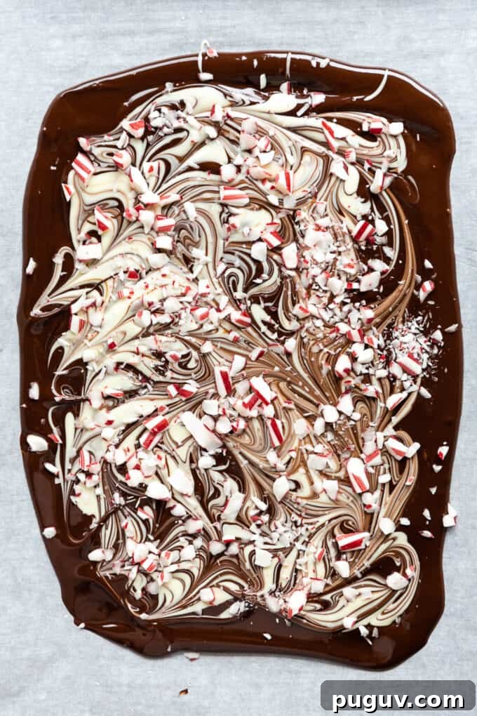 melted dark and white chocolate bark with crushed candy canes on top