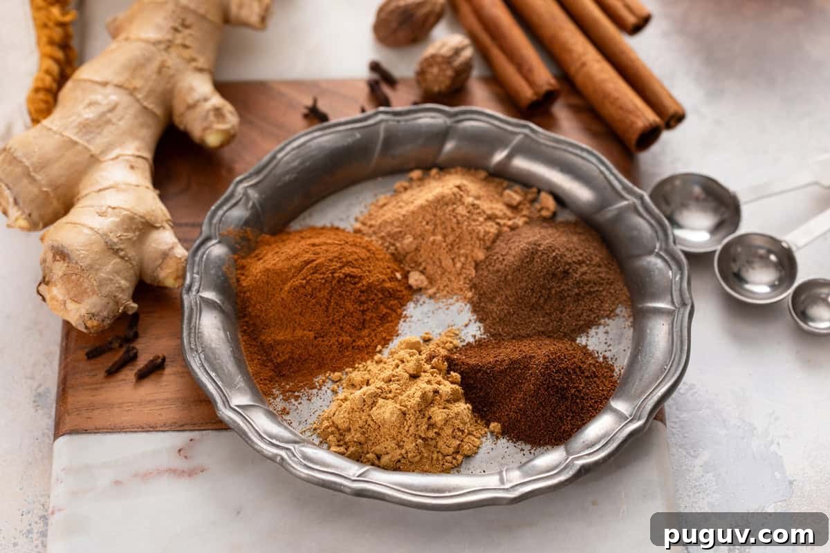 How to Make Pumpkin Pie Spice at Home for Cozy Fall Baking 7 Plate holding each of the spices for pumpkin pie spice.