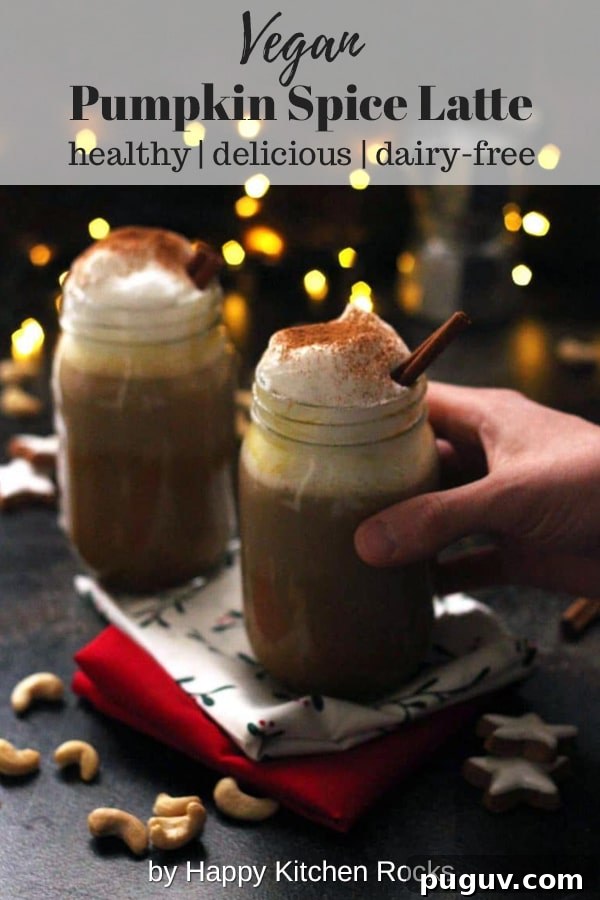 Healthy Vegan Pumpkin Spice Latte - Holding One Mason Jar with Lights in the Background